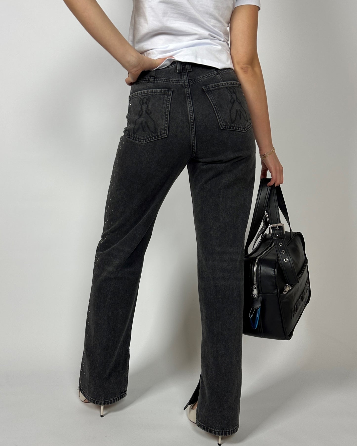 Jeans con borchie nero