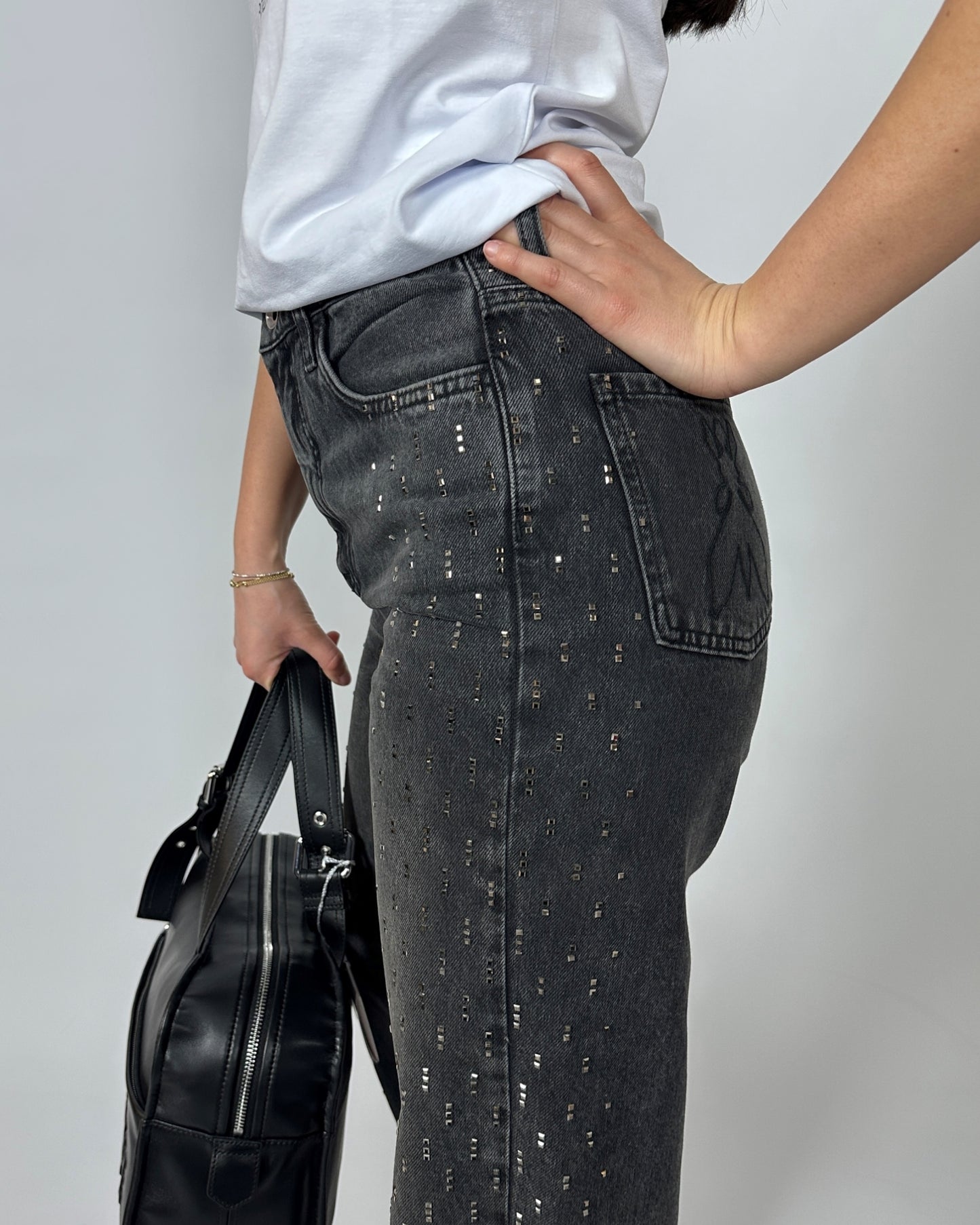 Jeans con borchie nero